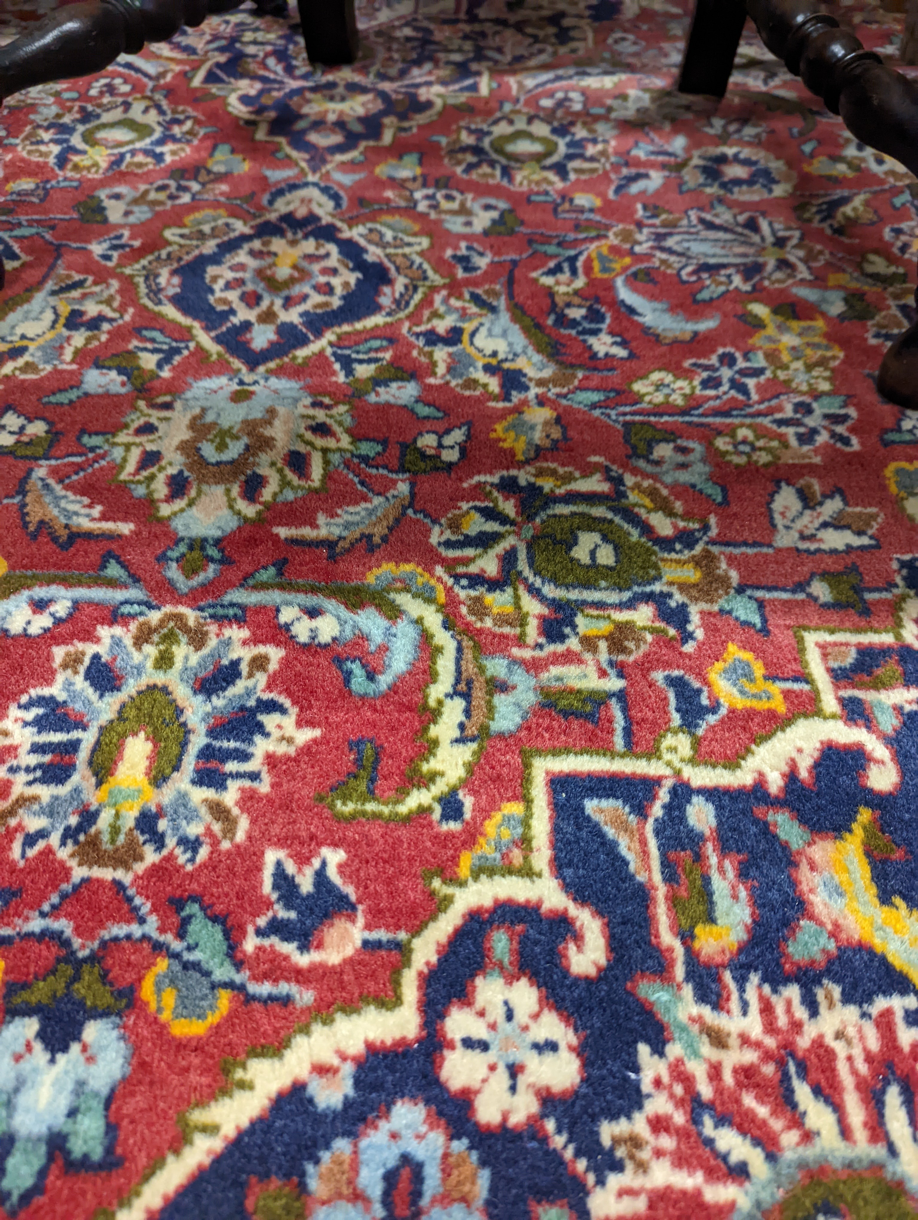 A Heriz red ground carpet, 320 x 204cm